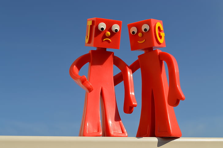 two red plastic cartoon characters