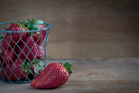 pile of strawberry inside the container