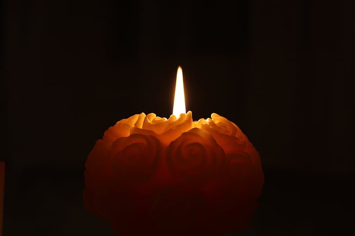 orange candle in the dark