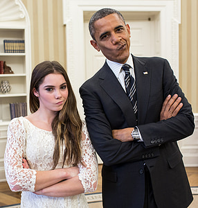 Barack Obama beside McKayla Maroney