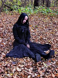 woman wearing black long-sleeved dress