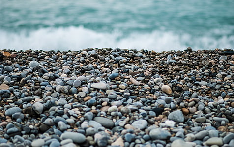 close up photo of rocks near body of water