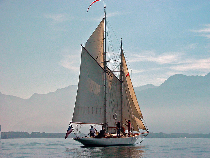 photo of white sailboat