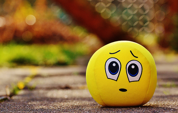 Royalty-Free photo: Closeup photo of yellow emoji plush toy | PickPik