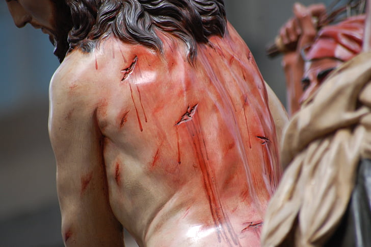close-up photo of Jesus Christ figurine