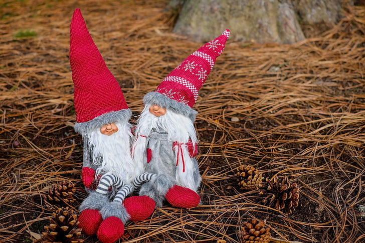 gray-white-and-red gnome dolls