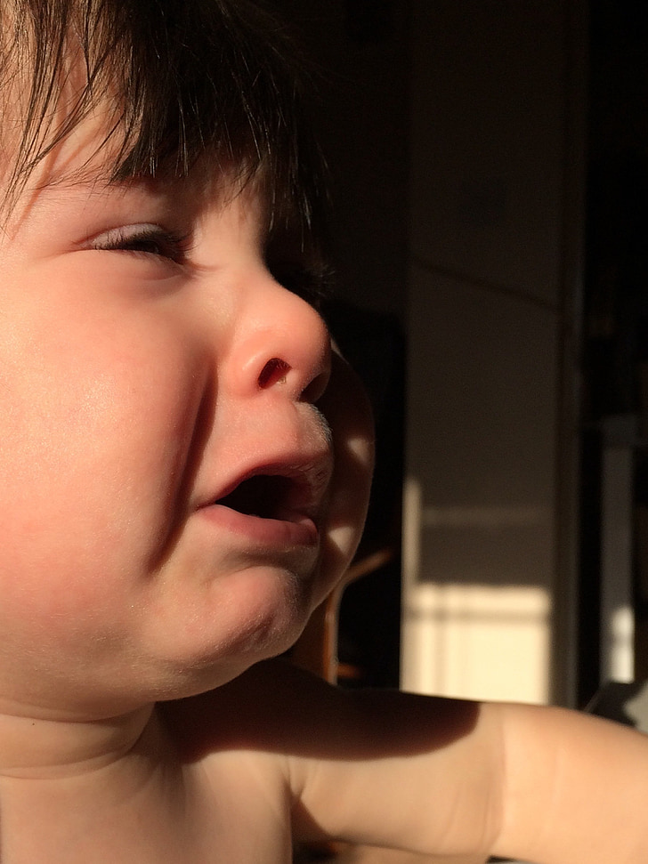 photograph of crying toddler