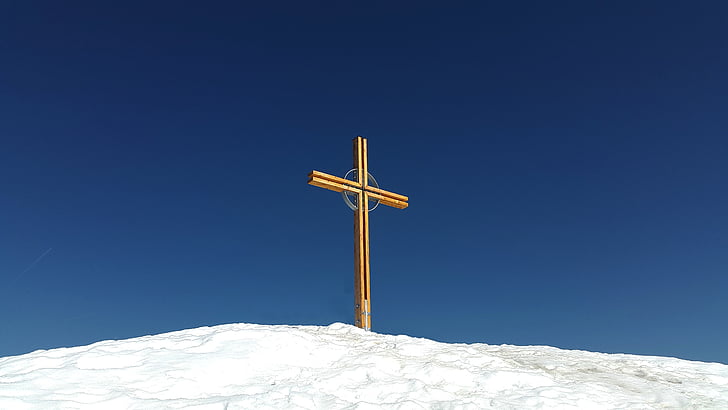 brown cross on snowfield