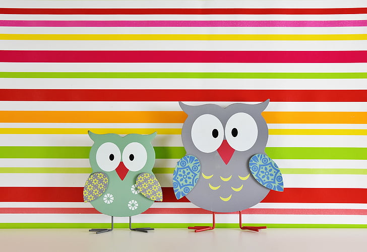 two assorted-color bird wooden decor