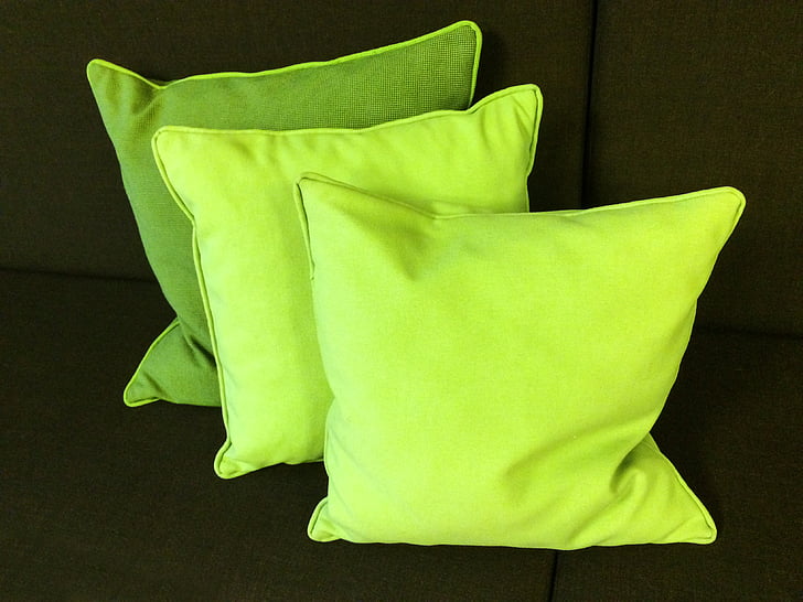 three green throw pillows