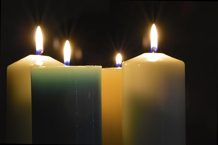white and green lighted pillar candles