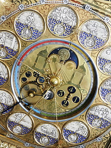 gold-colored anallog clock