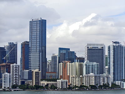 assorted buildings near body of water