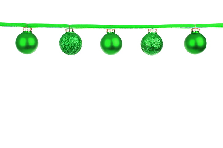 five green baubles on white background