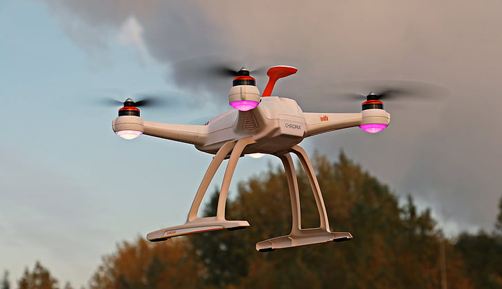 white quad copter drone