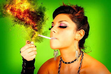woman igniting cigarette