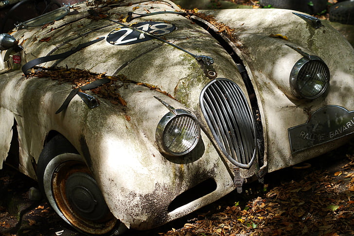 abandoned white vintage car