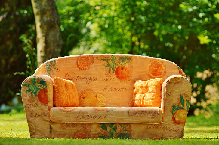 oranges and lemons printed fabric sofa on grass lawn
