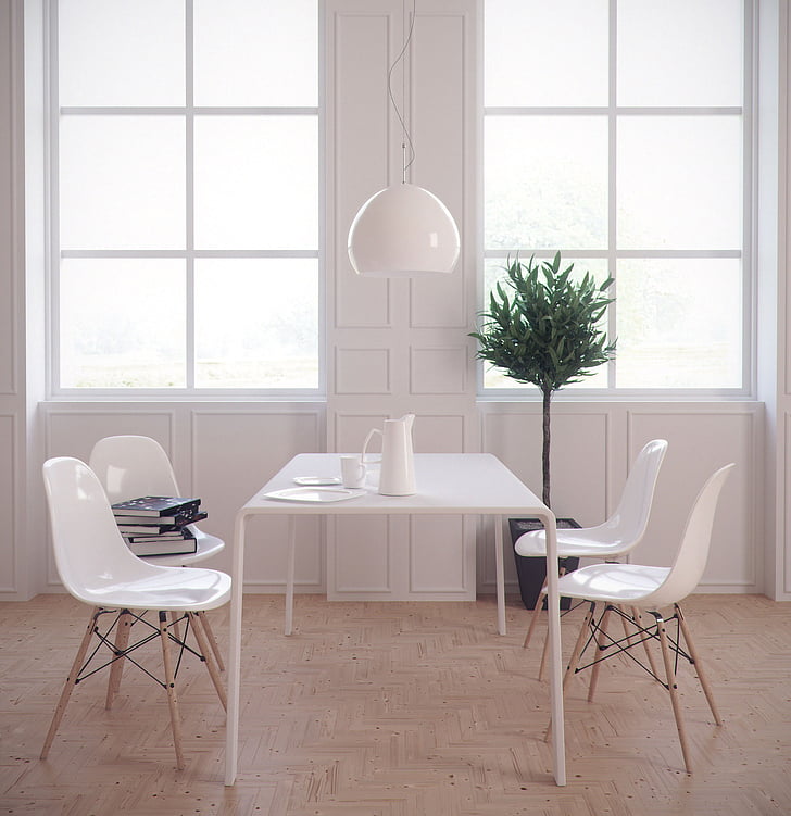 white table and four chairs near windows
