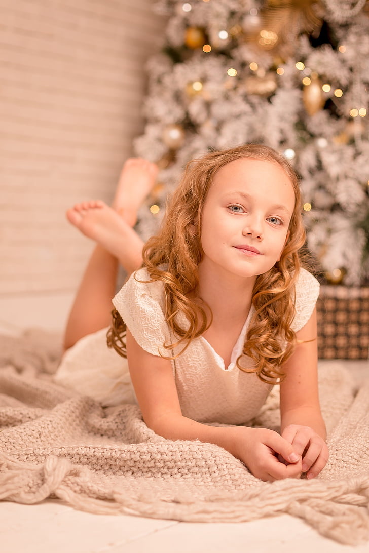Little Girl Lovely Baby With Tails In Holiday Clothes Stock Photo, Picture  and Royalty Free Image. Image 150601590.