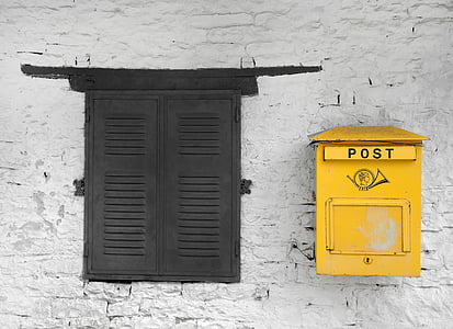two black and yellow mail boxes