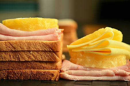 sliced cheese and bacon with loaf bread