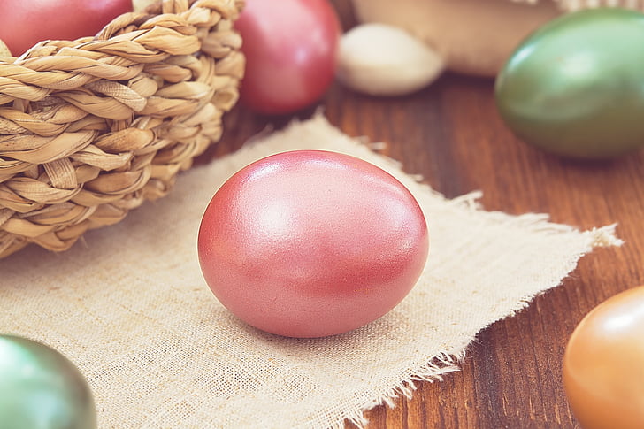 pink painted egg on burlap
