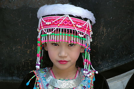 girl wearing beaded multicolored head dress