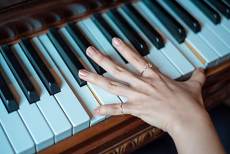 person playing piano keys
