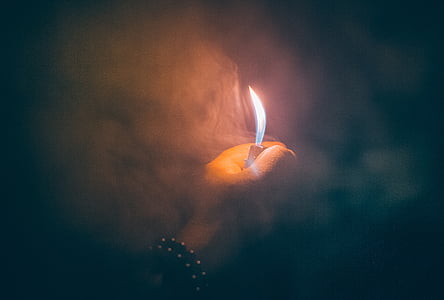 photography of person lighting up a lighter