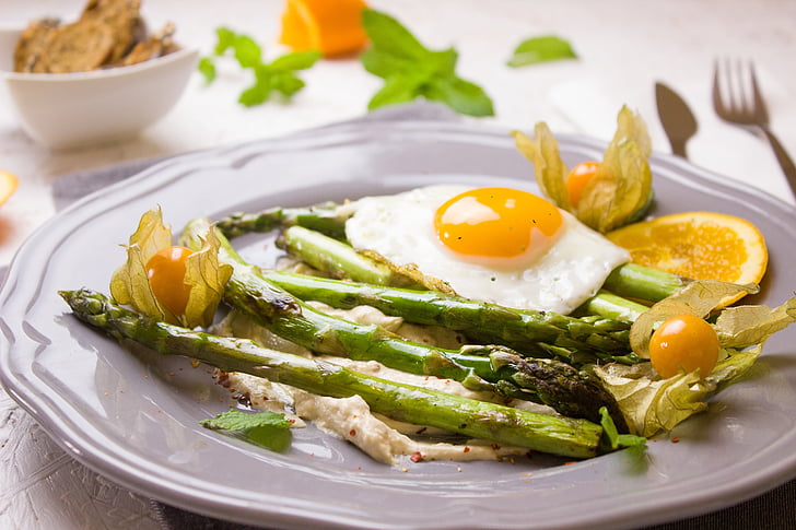 asparagus, egg, and physalis fruit