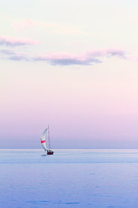 sailboat at the center of body of water