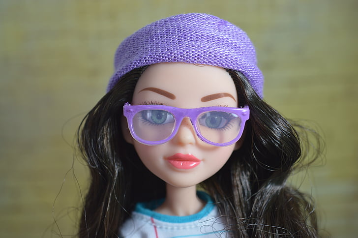 closeup photo of doll wearing purple eyeglasses