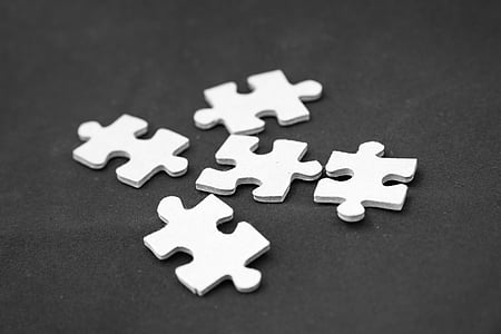 five white puzzle pieces