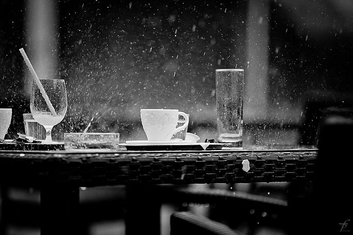 grayscale photo of glasses during rain