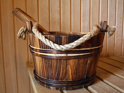 brown wooden bucket on brown wooden surface