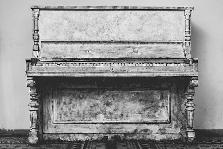 gray wooden upright piano