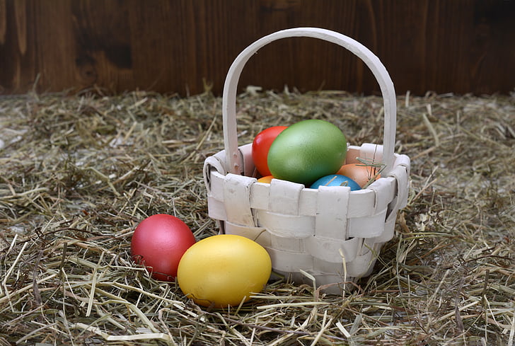 white wicker basket and easter eggs