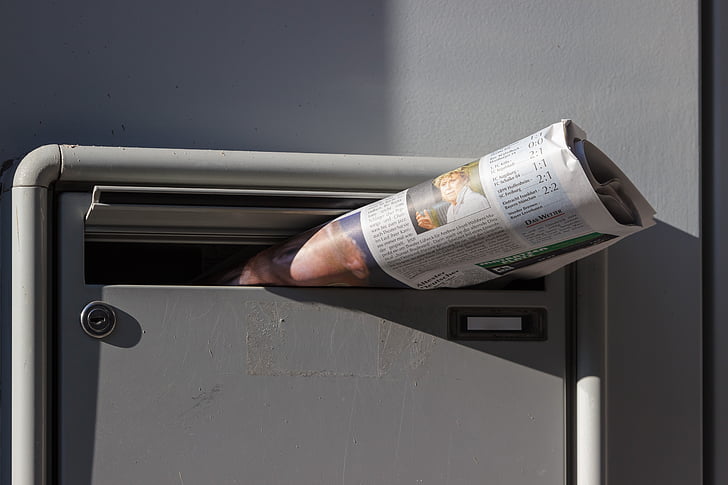 newspaper on mailbox