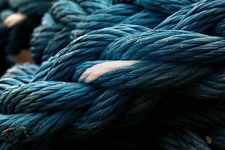 closeup photography of blue braided rope