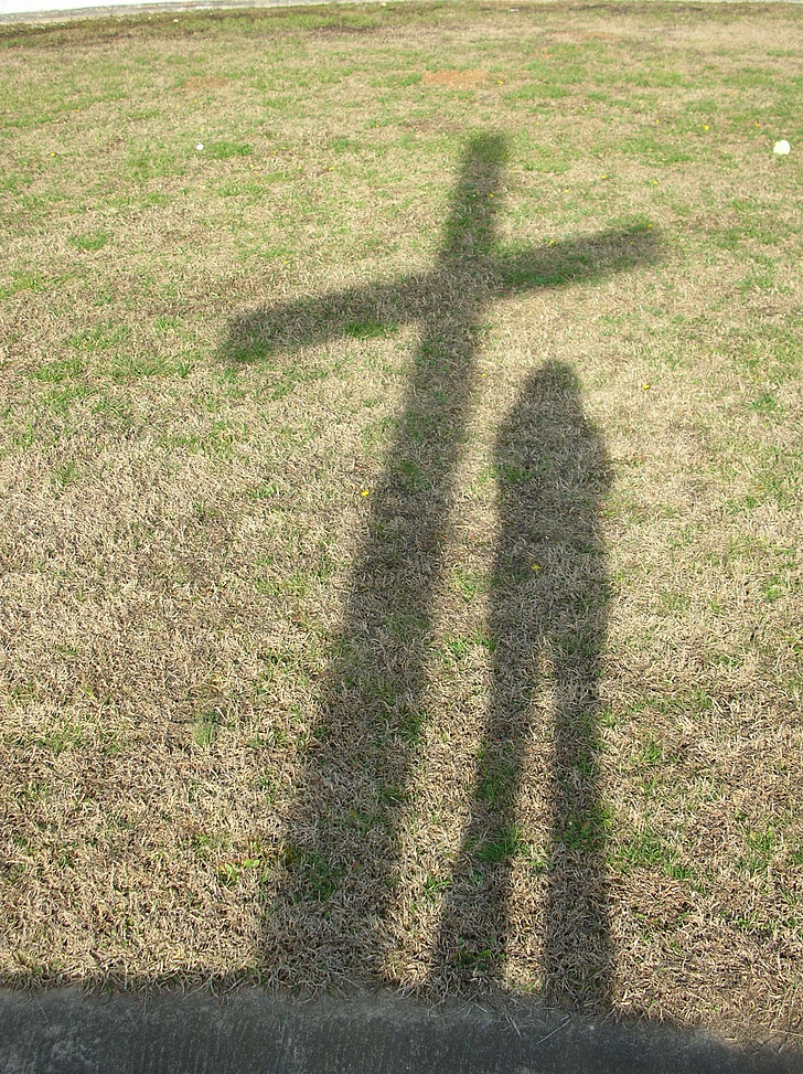shadow of cross and person