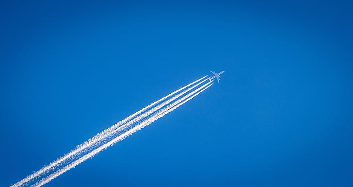 Royalty-Free photo: White plane with smoke trail | PickPik