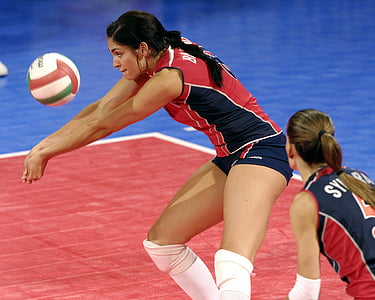 woman in red and blue volleyball jersey