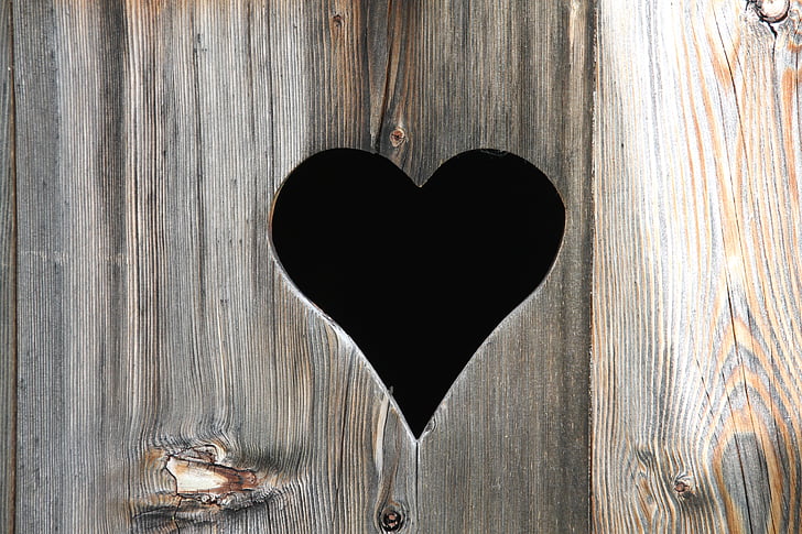 brown wooden board with heart design