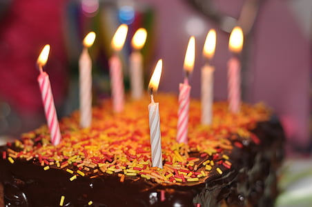 close-up photography of chocolate birthday cake with candles top