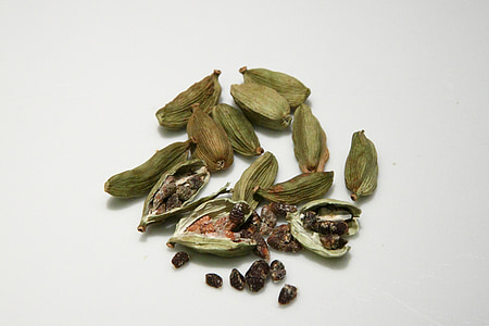 dried seeds on white surface