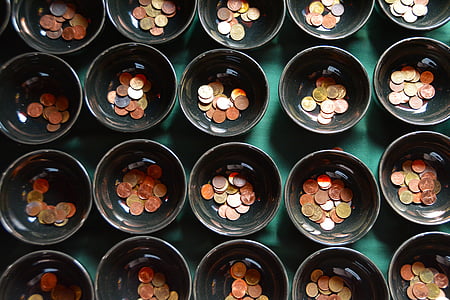 copper-colored coins in bowls