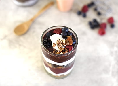 clear glass cup with assorted berries and nuts