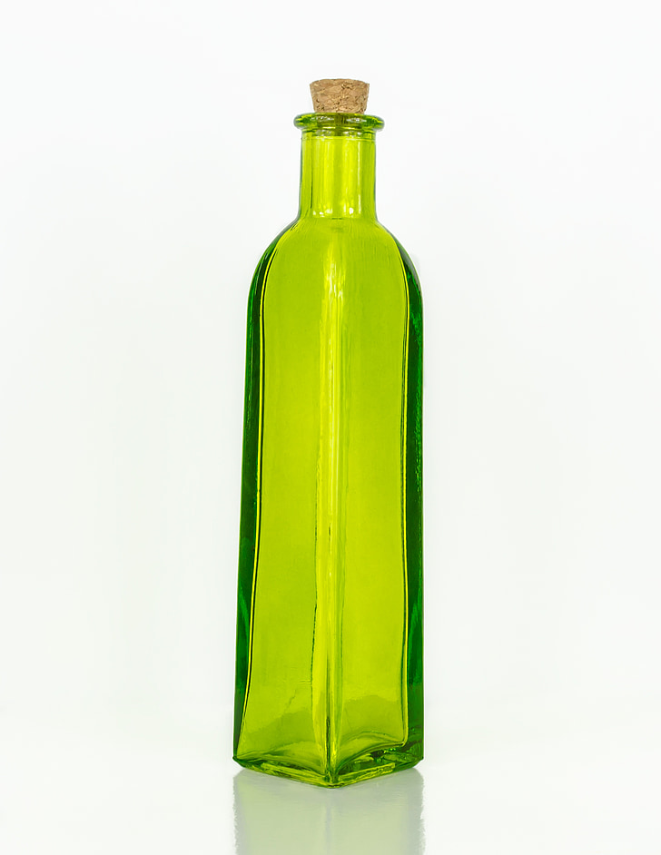translucent green glass bottle