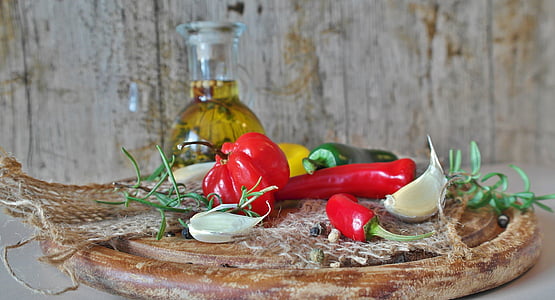 garlic and chili pepper on chopping board